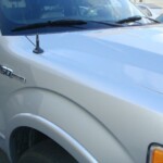Before and after photographs of a damaged Ford pickup truck that was repaired by Elite Paint & Body Shop in West Palm Beach, Florida.